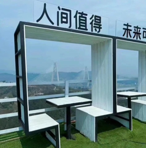 A close view of frame-shaped seating booths with tables and benches.